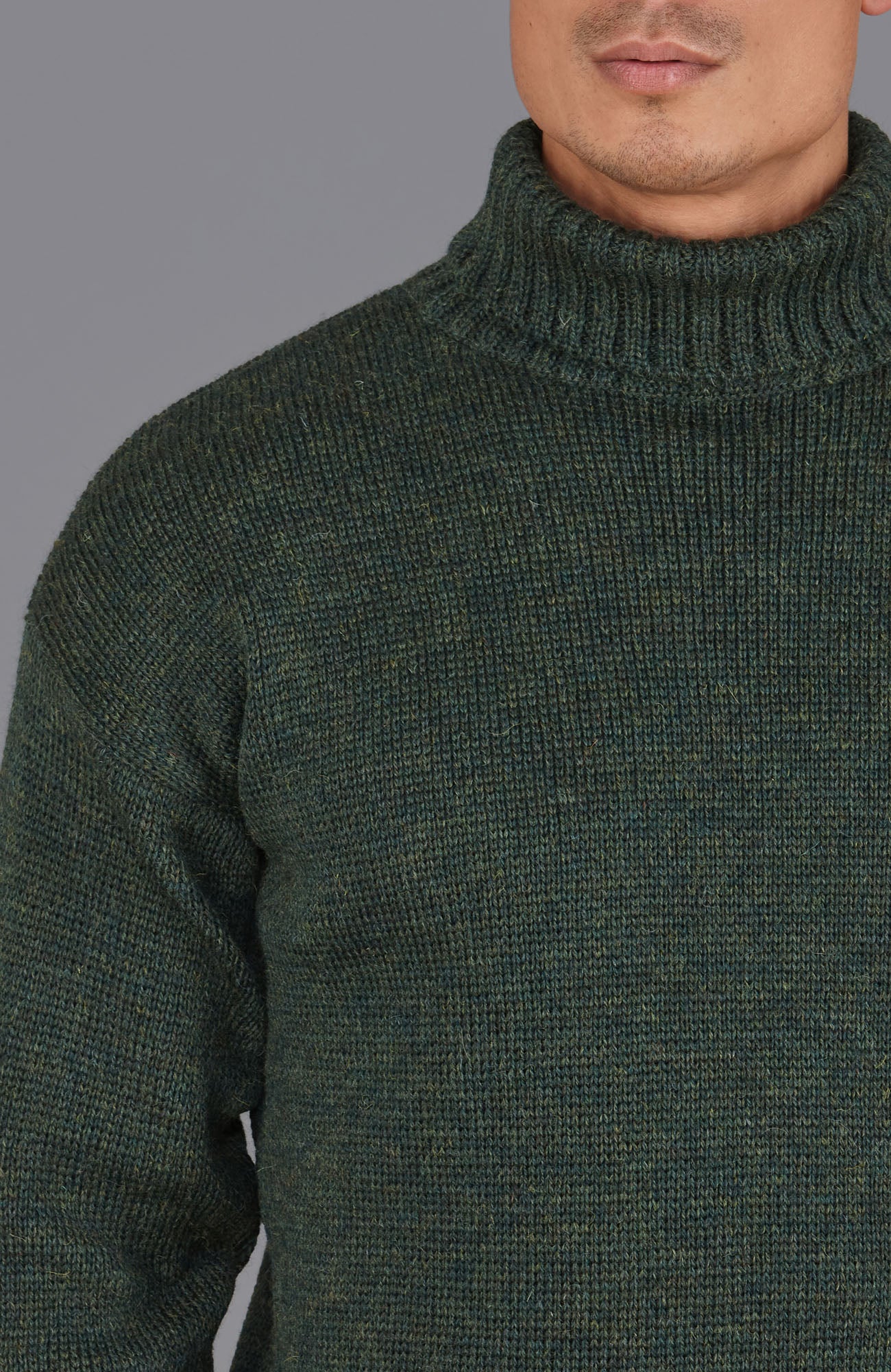 green roll neck wool jumper