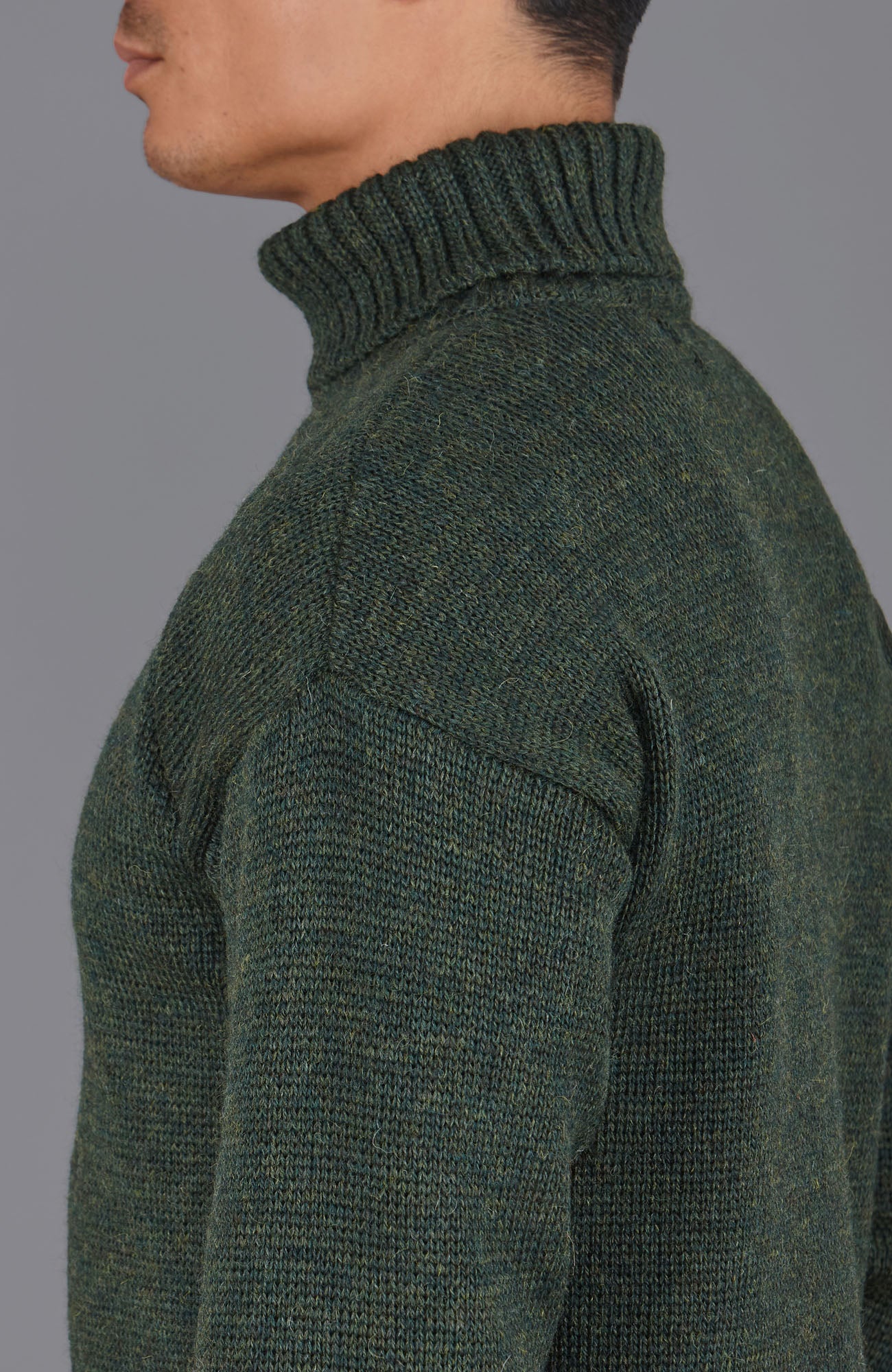 green roll neck wool jumper